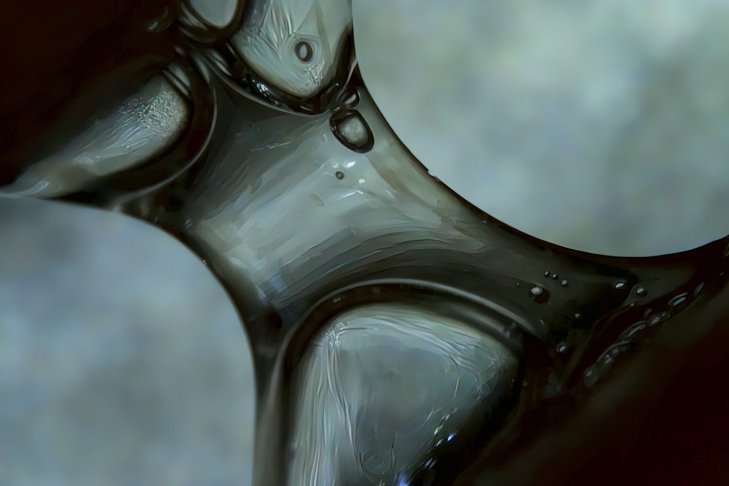 A close-up macro photograph of a translucent, wave-like surface in cool green and grey tones, resembling flowing liquid glass